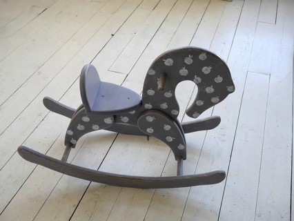Wooden horse on the floor in vintage interior