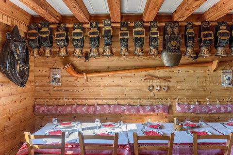 Cow bells displayed in restaurant of mountain farm. Vosges, Alsace, France