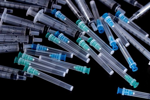 Medical Sterile Syringes Needles, Close up Syringes on Black Background