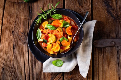 Vegetarian courgette ratatouille with tomato sauce and herbs