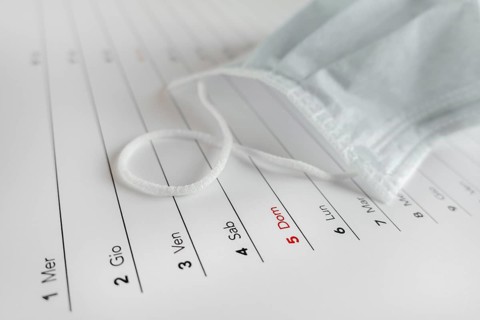Montly calendar with self protection face mask. Coronavirus concept. Beginning / end of the