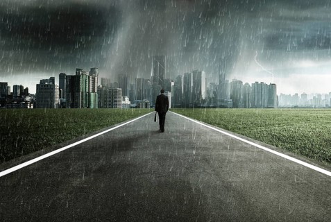 Business man facing a storm, victory concept