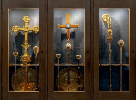 Chester, United Kingdom, 26 August, 2022: ornate golden crosses and Bishop staff in a display case