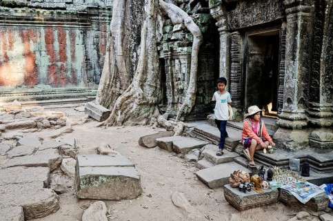 Souvenir trinket stall vendor in angkor wat famous landmark buddhist temple ruins near siem reap