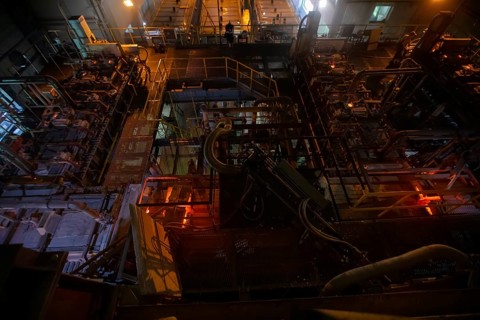 Glassworks. Industrial furnace for the production of glass in the factory workshop