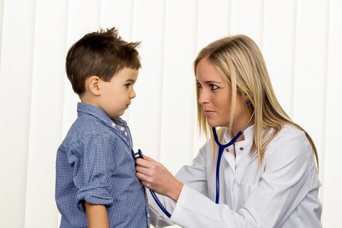 Doctor and little boy, symbol for diseases, diagnostics, heart defects