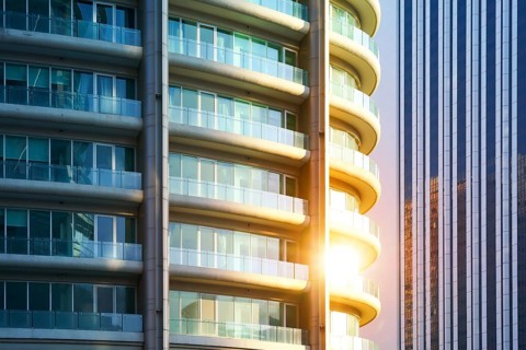 Urban abstract close up view of steel and glass windows facade office building
