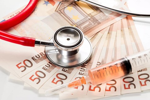 Stethoscope and syringe are on 50 euro notes