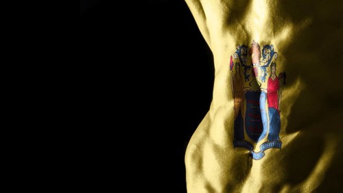 New Jersey flag on abs muscles, New Jersey bodybuilding concept, black background