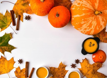 Autumn food. Frame of pumpkin puree soup, leaves. Top view. Autumn harvest, pumpkins, leaves on