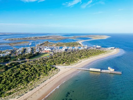 Aerial views of Queenscliff pier and Sorrento ferry area at dusk on a summer's day on the Bellarine