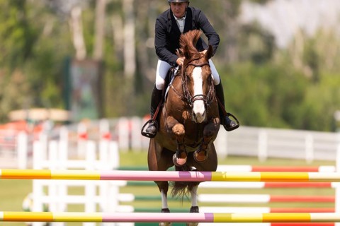 Jordan Coyle of Ireland and riding Jorisca, compete in the 1.60m Grand Prix during The Continental