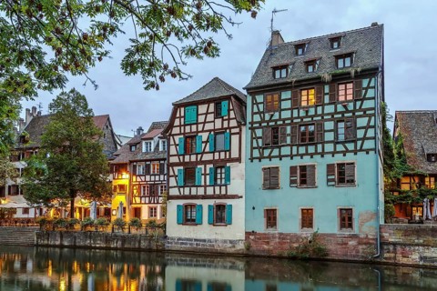 Historic houses on the embankment of the Ill river in Petite France district in Strasbourg, France.