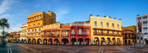 Panorama of an ensemble of colorful historic buildings on a sunny day in Cartagena, Colombia,