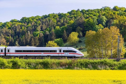 InterCityExpress ICE travelling across the Swabian Alb. Idyllic landscape in spring. Lonsee,