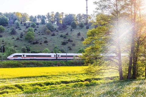 InterCityExpress ICE travelling across the Swabian Alb. Idyllic landscape in spring. Lonsee,