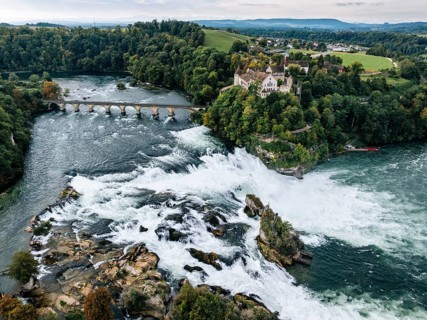 Aerial view of the Rhine Falls with railway viaduct and Laufen Castle in autumn, Neuhausen, Canton
