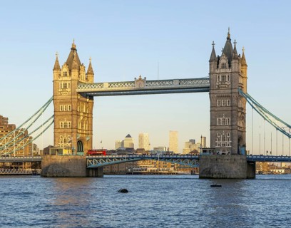 Tower Bridge in sunshine at dusk, River Thames from Southwark, London, England, UK