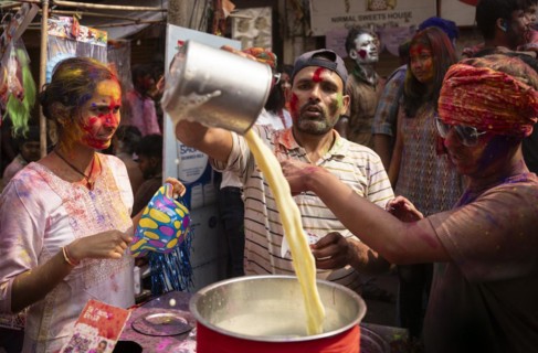 A person selling bhang lassi on a street, during the holi festival, the Hindu spring festival of