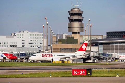 Swiss airline aircraft at Zurich Airport. Terminal and tower. Zurich, Switzerland