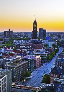 City view from above with the main church St Michaelis and the Dancing Towers at sunset, Hamburg,