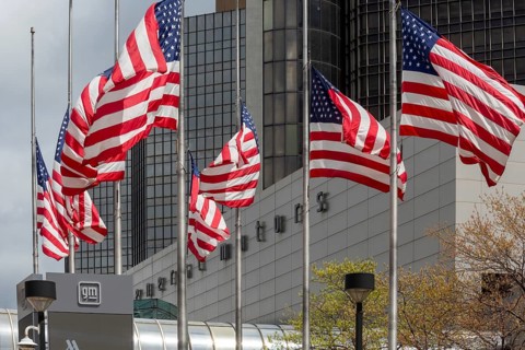 Detroit, Michigan - American flags flying in front of the General Motors headquarters in the
