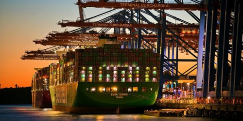 Container terminal Burchardkai with full container ship Ever Genius from Panama in the evening,
