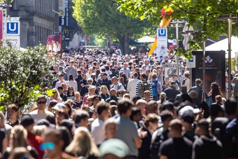 Many people on the way in the pedestrian zone Königsstraße. Crowd in Stuttgart, Baden-Württemberg,