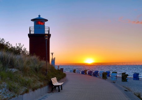 Olhörn lighthouse at colourful sunrise over the sea on the North Frisian island of Föhr,