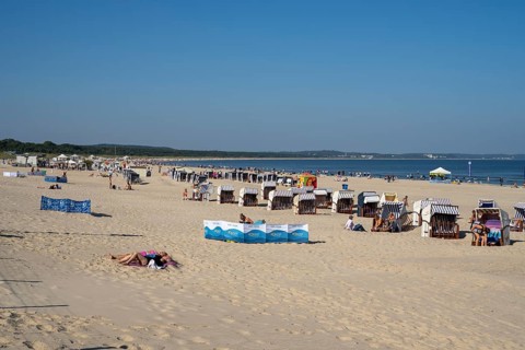 Beach chairs and tourists on the sandy beach, Swinemünde, Usedom Island, Baltic Sea, Poland