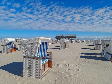 Preparing for the high season on the beach, setting up the beach chairs, North Sea, on the edge of