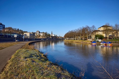 River Saar, bank, trees, meadow, reflections on the water surface, footpath and cycle path,