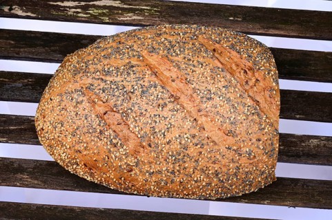 Top view of a world champion bread, multigrain bread, loaf with sesame, poppy and linseed on the