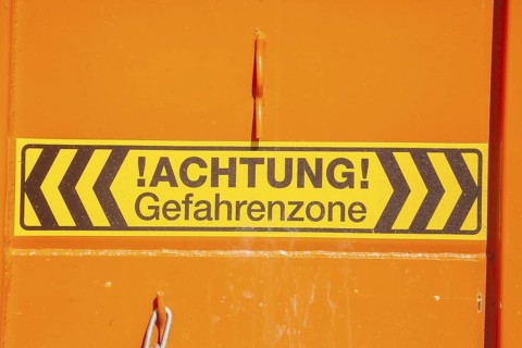 Caution danger zone sign at a construction site, Germany