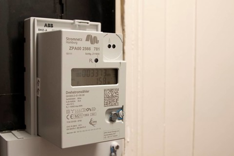 Symbolic image of energy costs in the household, digital electricity meter in a flat, operator