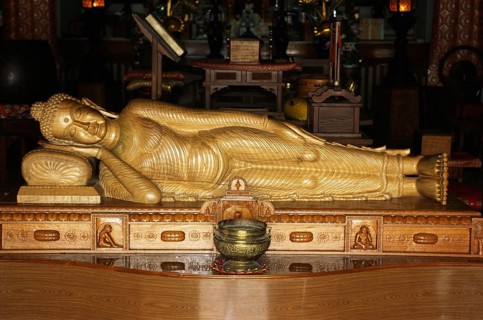 Nirvana, sleeping Buddha sandal wood statue in Horinji Japanese temple, Sarnath, Uttar Pradesh,