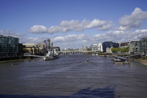 View of the River Thames from Tower Bridge in the City of London with bridges and modern