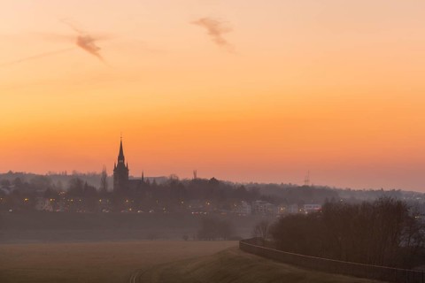 Sunset with the Briesnitz church, large amounts of Sahara dust colour the evening sky particularly