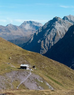 Ramozhütte SAC, Davos mountains in the back with Weissfluh peak, drone shot, Welschtobel, Arosa,