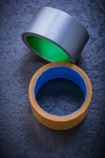 Adhesive tape on black background Construction concept