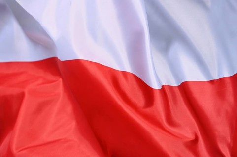 Close-up of the flag of Poland waving in the wind with wave pattern
