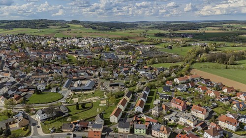 Panorama of a town and surrounding green landscape under a cloudy sky, Mitterteich, Upper