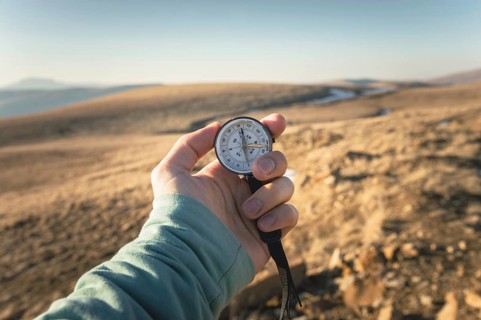 Compass in Hand Natural background .Vintage Tone