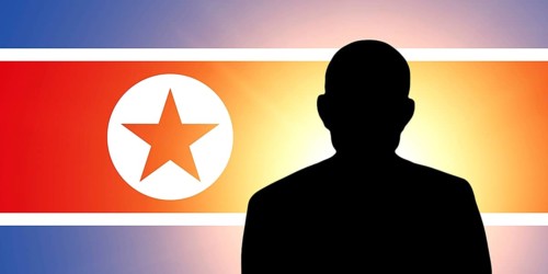 The North Korea flag and the silhouette of an unknown man