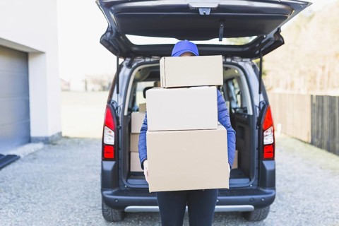 Anonymous courier with plenty boxes. Resolution and high quality beautiful photo