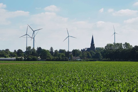 Wind turbines for power generation on the edge of the Garzweiler open-cast lignite mine, with a