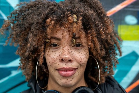 Close up portrait of woman with freckles