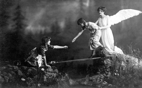 Guardian angel angel, 1930s, Angel helping a child while a woman watches from a rock, historical