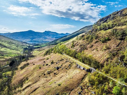 Mountains over Glen Ogle Viaduct from a drone, Road A85, Scotland, UK