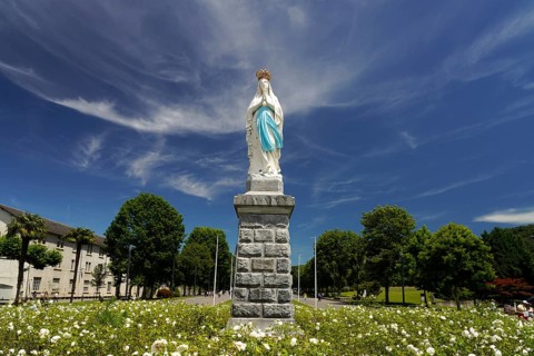 Statue of the Crowned Madonna of Our Lady in Lourdes on Rosary Square in the Marian pilgrimage town